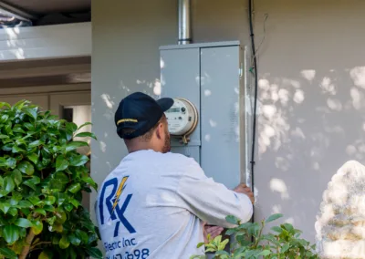 A technician servicing an outdoor home gas heater.