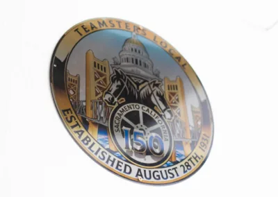 Teamsters local 150 emblem with an illustration of the capitol building, celebrating an establishment date of august 28th.